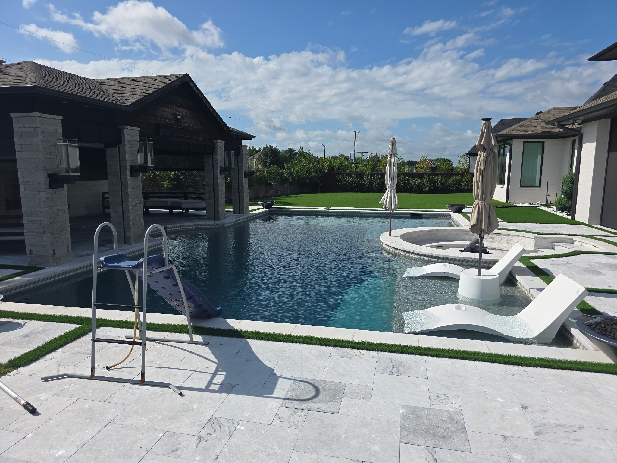 Luxury infinity pool with artificial turf surround, Prosper TX
